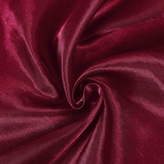 Burgundy satin fabric texture with a smooth, glossy finish.