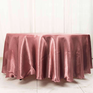 Add Elegance to Your Event with the 108" Cinnamon Rose Satin Round Tablecloth Add Elegance to Your Event with the 108" Cinnamon Rose Satin Round Tablecloth
