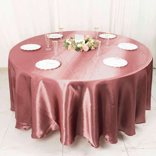 Elevate Your Tables with the 108" Cinnamon Rose Satin Round Tablecloth Elevate Your Tables with the 108" Cinnamon Rose Satin Round Tablecloth