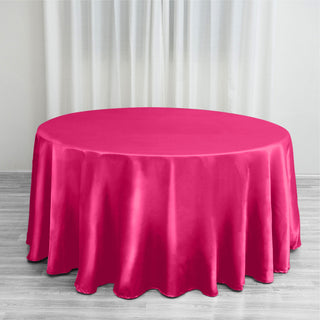Add Elegance to Your Event with the 120" Fuchsia Seamless Satin Round Tablecloth