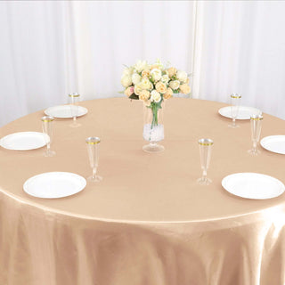 Effortless Elegance with the 120" Nude Seamless Satin Round Tablecloth Effortless Elegance with the 120" Nude Seamless Satin Round Tablecloth