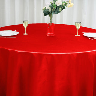 Elevate Your Event Decor with the 120" Red Seamless Satin Round Tablecloth