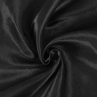 Black satin fabric with a smooth, shiny texture.