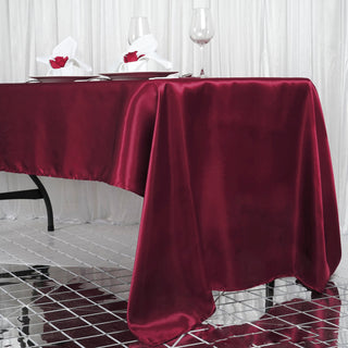 Enhance Your Event Decor with a Burgundy Satin Tablecloth