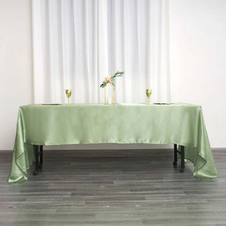 Elegant green tablecloth draped over a table set for a stylish gathering.