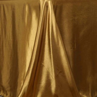 Transform Your Event with the 90"x156" Gold Seamless Satin Rectangular Tablecloth Transform Your Event with the 90"x156" Gold Seamless Satin Rectangular Tablecloth