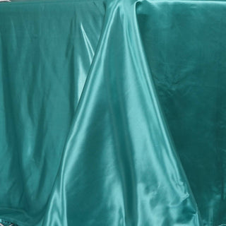 Create a Mesmerizing Tablescape with our Turquoise Satin Tablecloth