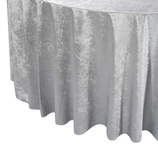 Silver tablecloth with a textured finish, draping elegantly.