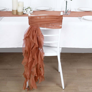 Rust-colored chair sash draped elegantly on a white chair in a styled setting.