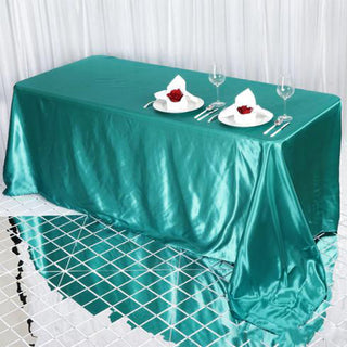 Create a Festive Atmosphere with our Turquoise Satin Tablecloth