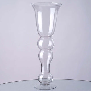 Clear glass vase with a unique bubbled design.