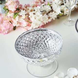 Crystal glass bowl with diamond pattern on a white background.