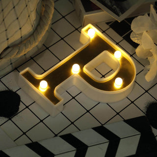 Decorative light-up letter "P" in modern design.