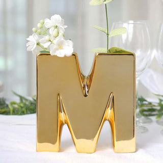 Add Elegance to Your Décor with the Shiny Gold Plated Ceramic Letter M Bud Vase Add Elegance to Your Décor with the Shiny Gold Plated Ceramic Letter M Bud Vase