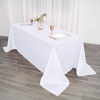Elevate Your Event with the 90"x132" White Seamless Polyester Rectangular Tablecloth