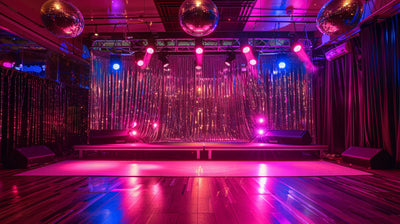 Disco dance floor with pink lighting and mirror balls
