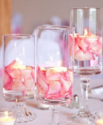 Rose petals in stem vases
