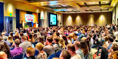 Conference audience listening to a speaker in a banquet hall