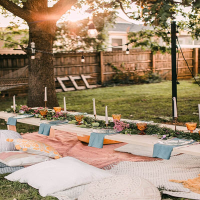 Backyard BBQ table setting under a tree