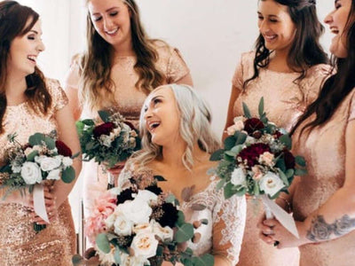 Bridesmaids holding wedding bouquets