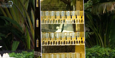 Gold champagne glass wall with glasses filled and neatly arranged for an elegant display.