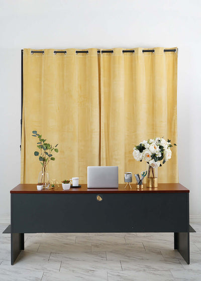 Gold backdrop behind office desk