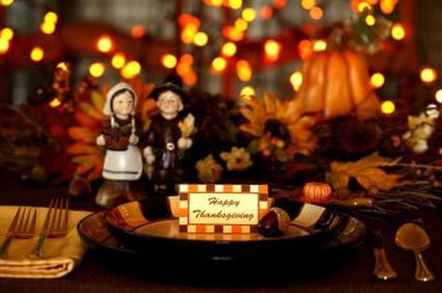 Thanksgiving table setting with candles and autumn decor