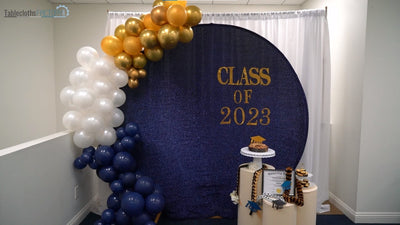 Graduation backdrop with gold, white, and navy balloons