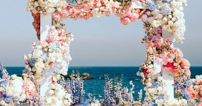 Floral wedding backdrop by the sea