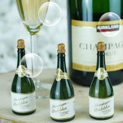 Mini champagne bottles with glasses and a champagne bottle