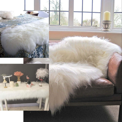 White sheepskin rug draped over a bed