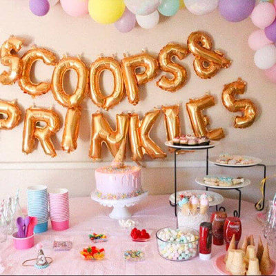 Ice cream party dessert table with gold balloon letters