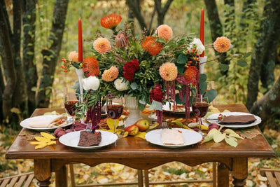 Fall tablescape with floral centerpiece and candles