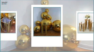 Completed golden pedestal and balloon display with arranged gold plinths and metallic gold balloons.