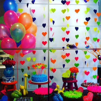 Colorful party decor with balloons and heart garlands