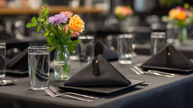 Black table setting with flowers