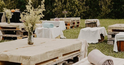 Outdoor tables with white linens and floral centerpieces
