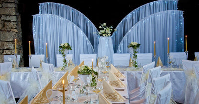 Wedding reception table with Chiara arch backdrop