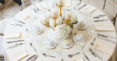 White round tablecloth on a set wedding reception table