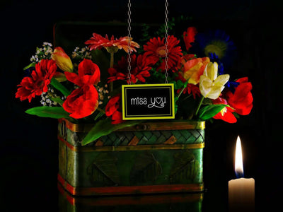 Memorial table with flowers and candle