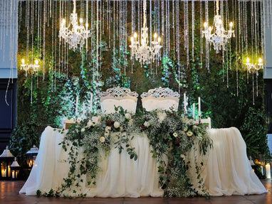 Floral wedding stage with chandeliers
