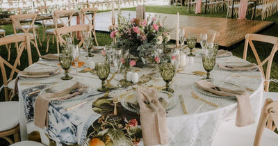 Outdoor wedding table set with floral centerpiece