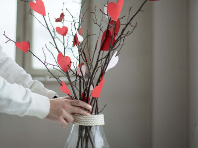 Branches decorated with red and white paper hearts