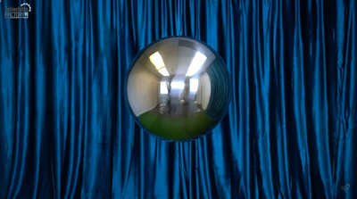 Blue velvet backdrop with mirrored sphere
