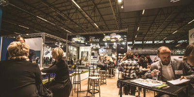 Corporate event networking area at an exhibition booth