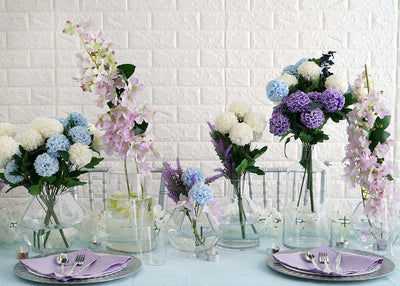 Pastel floral tablescape with vases and lavender napkins