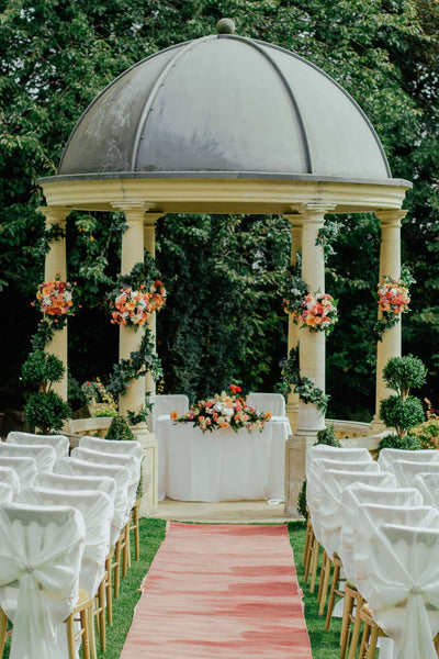 Outdoor wedding pavilion with floral decorations