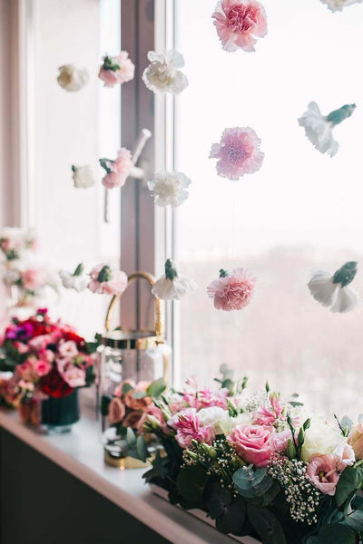 Hanging pink and white paper flowers