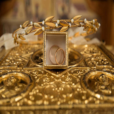 Gold ring box with wedding bands