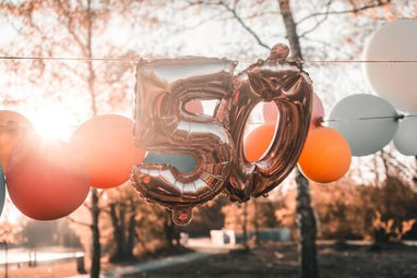 Gold 50th birthday balloon display